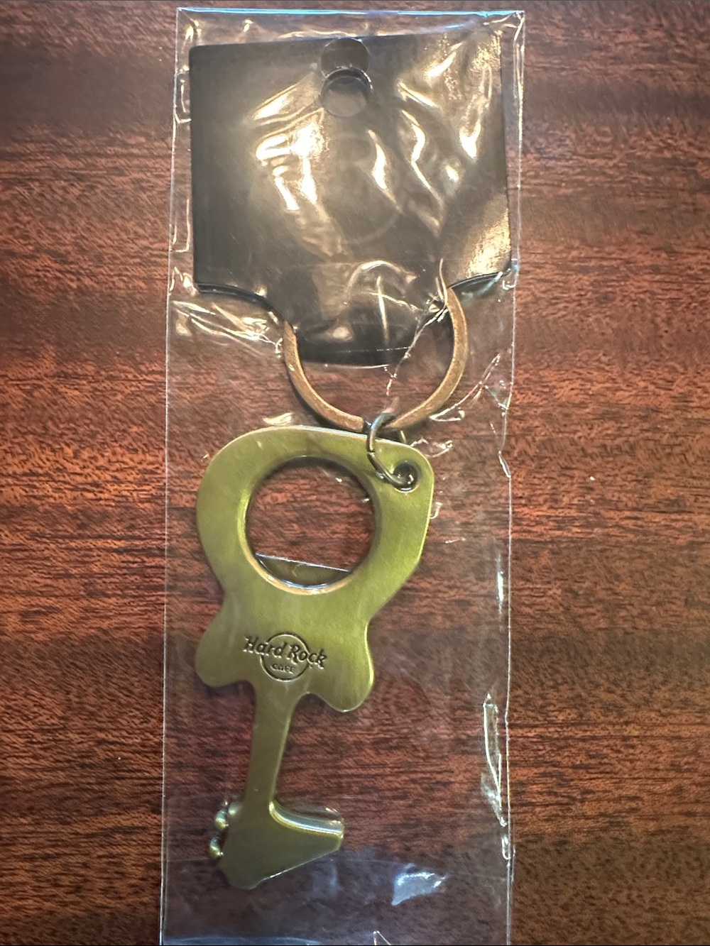 Hard Rock Cafe brass-toned key-shaped bottle opener keyring